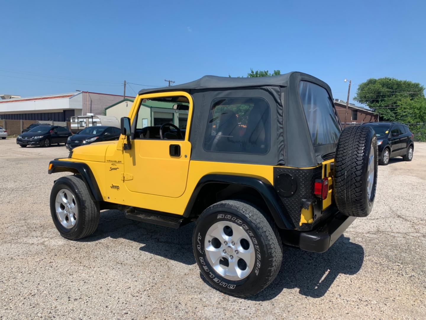 2001 Yellow /Black Jeep Wrangler WRANGLER (1J4FA49S81P) with an 6 Cylinders S 4.0L FI OHV 242 CID engine, AUTOMATIC transmission, located at 1830 North Belt Line Road, Irving, TX, 75061, (469) 524-0199, 32.834373, -96.993584 - Photo#3